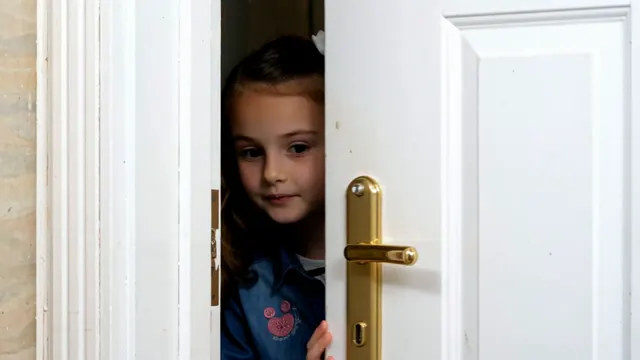 A surprised look at the door